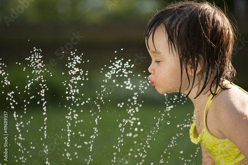 Photo: Child drinking from the water fountain Child drinking from the water fountain