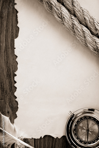 Photo: ropes and compass on old paper ropes and compass on old paper