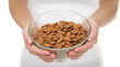 Almonds - woman showing almond bowl closeup