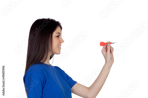 Photo: Attractive girl smiling throwing a dart Attractive girl smiling throwing a dart