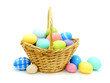 Easter basket with colorful eggs over white