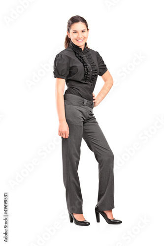 Photo: Full length portrait of a young professional woman posing Full length portrait of a young professional woman posing