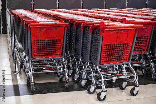Photo: rows of shopping cart in the store rows of shopping cart in the store