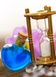 Photo: Sanduhr mit bunten Fläschchen Sanduhr mit bunten Fläschchen