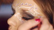 Video: young woman getting make up at studio close up young woman getting make up at studio close up