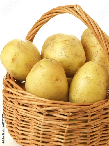 Photo: Potatoes in a wicker, isolated Potatoes in a wicker, isolated