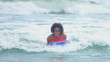 Happy Ethnic Girl Ocean Body Boarding