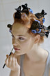 Photo: Putting make up. Putting make up.