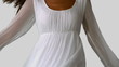 Girl in white dress twirling on white background