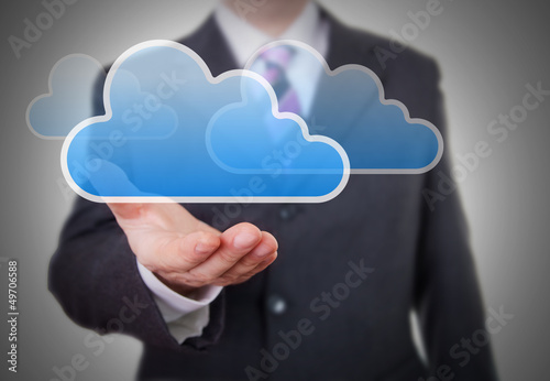 Photo: Businessman showing a Cloud Businessman showing a Cloud