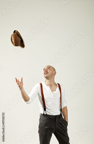 Photo: man throws his hat in air man throws his hat in air