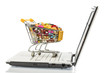 Tabletten mit Einkaufswagen und Computer