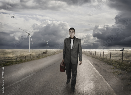 Photo: A young businessman walking on the road A young businessman walking on the road