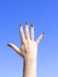 Hand reach to the blue sky
