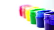 Rainbow paint pots in a line for gay pride