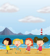 Four girls dancing at the beach