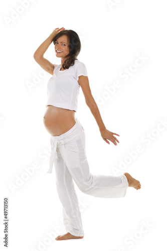 Photo: Glückliche schwangere Frau tanzt - pregnant woman dancing Glückliche schwangere Frau tanzt - pregnant woman dancing