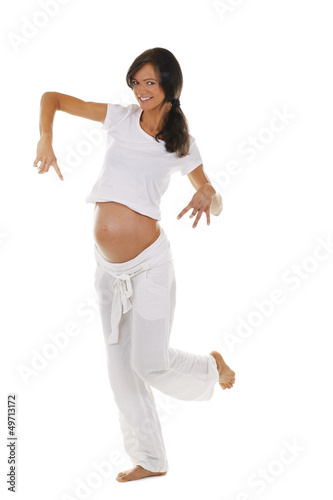 Photo: Glückliche schwangere Frau tanzt - pregnant woman dancing Glückliche schwangere Frau tanzt - pregnant woman dancing