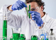 lab expert comparing test tubes