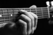 Brown guitar in hands in the guy playing it
