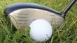 a golf ball in the grass ready to be hit