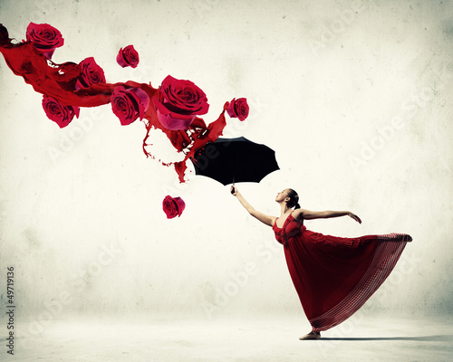 Photo: Ballet dancer in flying satin dress with umbrella Ballet dancer in flying satin dress with umbrella