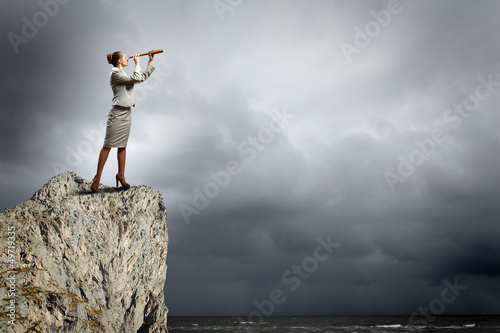 Photo: Business woman with telescope Business woman with telescope