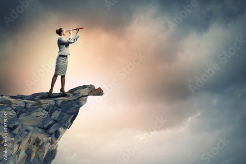 Photo: Business woman with telescope Business woman with telescope