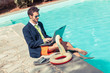 Photo: Funny Young Businessman with SwimmingTrunks next to the Pool Funny Young Businessman with SwimmingTrunks next to the Pool
