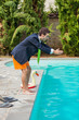 Photo: Funny Young Businessman with SwimmingTrunks Diving into the Poo Funny Young Businessman with SwimmingTrunks Diving into the Poo