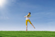 Beautiful woman dancing in park