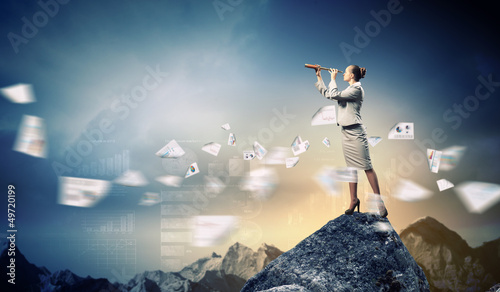 Photo: Business woman with telescope Business woman with telescope