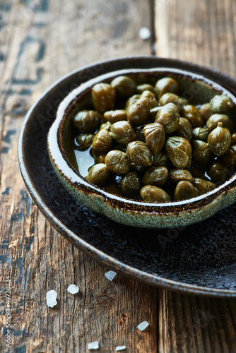 Photo: Pickled capers in a small dish Pickled capers in a small dish
