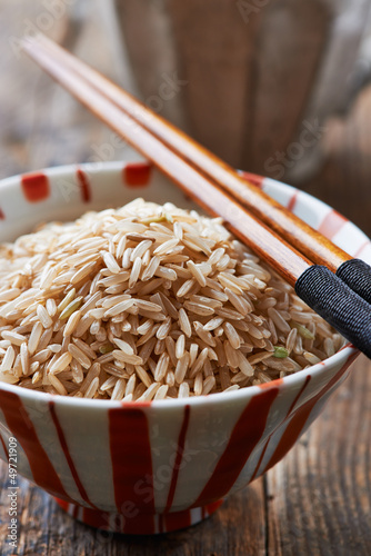 Photo: Bowl of brown rice with chopsticks Bowl of brown rice with chopsticks