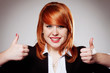 smiling businesswoman with thumbs up gesture