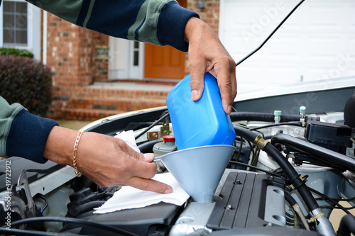 Photo: Mechanic Working On Car Mechanic Working On Car