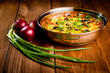 baked potato with cheese, on a wooden background