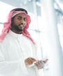 Photo: Arabic business man with tablet at office Arabic business man with tablet at office