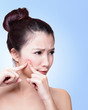 unhappy Woman finding acne on face