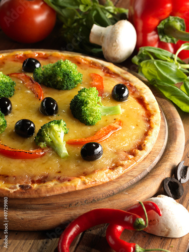 Photo: Pizza with ham, pepper and olives Pizza with ham, pepper and olives