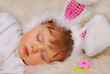 sleeping baby in easter bunny costume