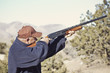 Foto: Man Shooting a Shotgun Hunting Man Shooting a Shotgun Hunting