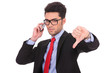 business man on phone shows thumb down