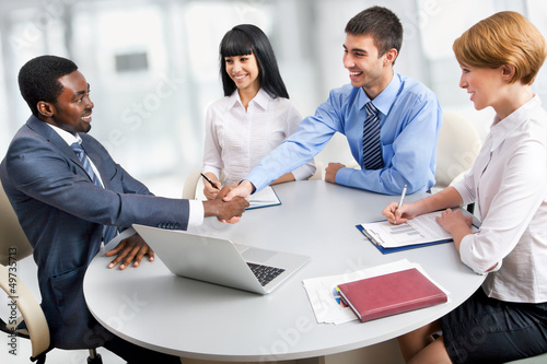 Photo: Business people shaking hands Business people shaking hands