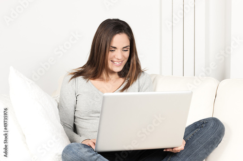 Photo: beautiful woman using laptop beautiful woman using laptop