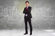 business man standing in front of a sketch of a big city