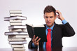 confused man reading at desk