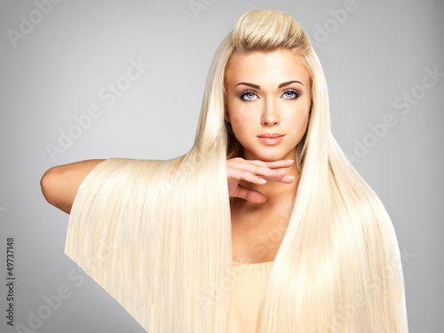 Photo: Blond woman with long straight hairs Blond woman with long straight hairs