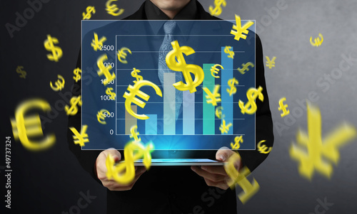 Photo: hand touch screen graph on a tablet hand touch screen graph on a tablet
