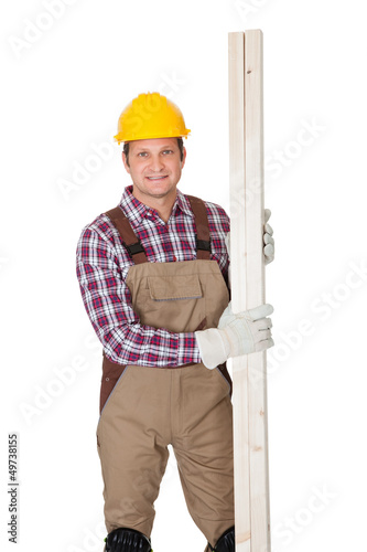 Photo: Carpenter with wooden planks Carpenter with wooden planks
